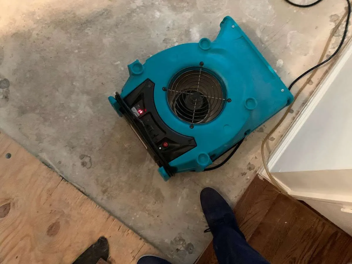 Air mover drying subfloor during Leak Detection & Repair in Wyomissing